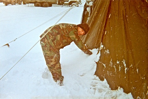 Packing snow around our GP Small to keep out cold air. (It was ice cold inside, regardless.)