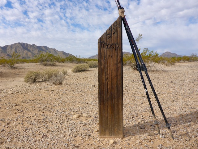An older marker, about mile 4.0. At least three different Scout troops put up markers. The notch in the Maricopa Mountains is Butterfield Pass. 2025-12-31: Marker still there, and legible.