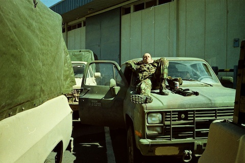 2LT McMurry sleeping on his truck.