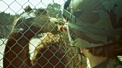 Nedra Nichols feeding a baby camel.