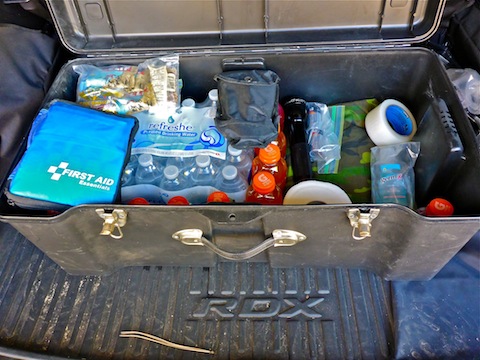 Off roading emergency kit: First aid, entrenching tool, toilet paper, hand cleanser, duct tape, flashlight, spare batteries, woobie, energy bars, case of water and case of Gatorade.