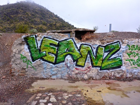 Cloud 9 restaurant graffiti. Shaw Butte summit in foggy background.