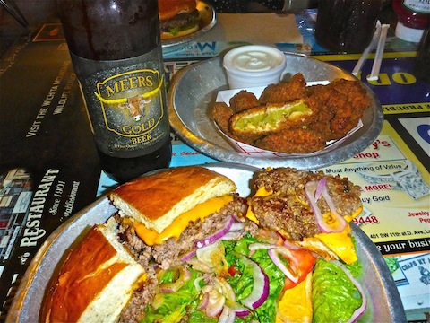 A massive plate-sized Meersburger, with a side of fried green tomatoes, and a Meers Gold Beer.