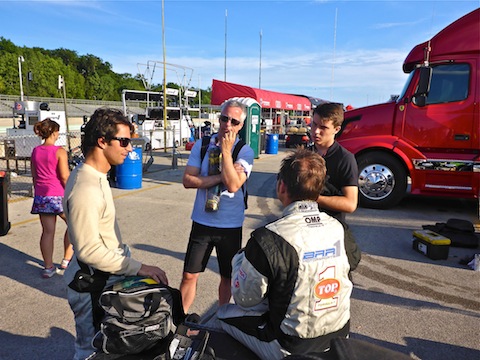 Post-race BAR1 debrief, with Bruno Junquiera, Chris McMurry, team owner Brian Alder (seated) and Matt McMurry.