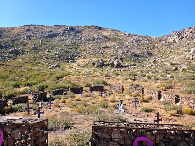 Looking past the gabions and crosses, back up canyon, towards the observation deck. When the Granite Mountain Hotshots left their lunch spot, "in the black", they descended via the saddle.