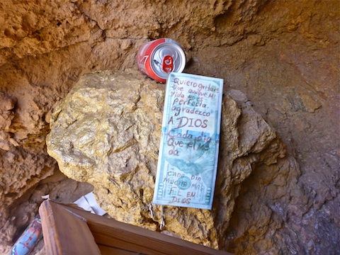 Memorial in alcove of boulder near intersection of NV-167 and NV-147. Note the gold-painted rock.