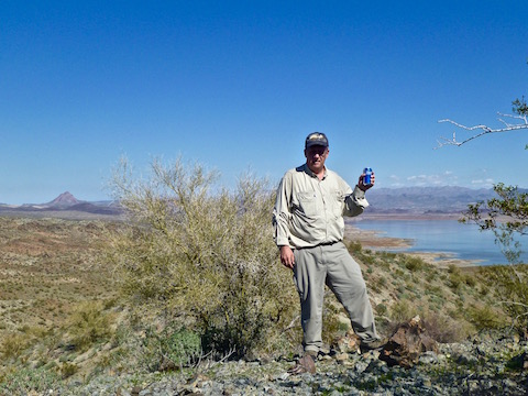 "Enjoying" a Bud Light on Hill 1655. Artillery Peak on the left; Alamo Lake below.