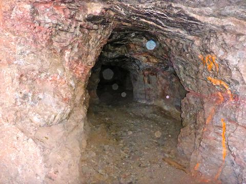 Inside Hargan Mine, with pink veins and flourescent markings.