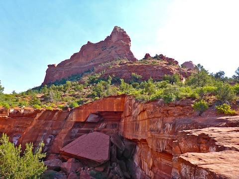 Devils Kitchen Sinkhole, with Morning Glory Spire n the background. The squarish chunk in the sinkhole collapsed during the 1989 event.