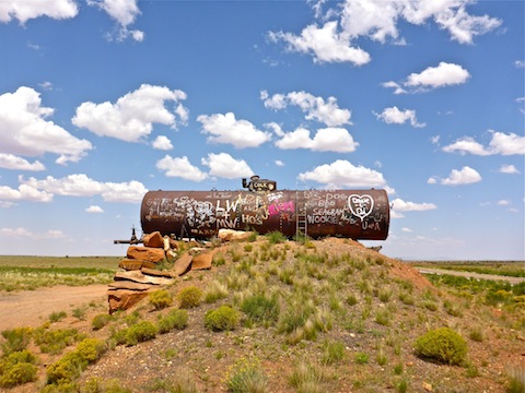 Graffiti-covered tank in the middle of nowhere south of Winslow.