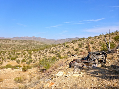Small, dry-rotted, frame at the top of the inclined shaft. US-93 visible in the distance.