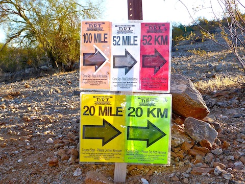 Trail running signs.