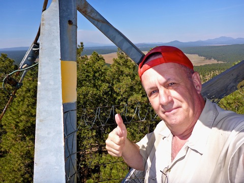 Me at the top of Woody Mountain Fire Loookout, with Rogers Lake in the background.
