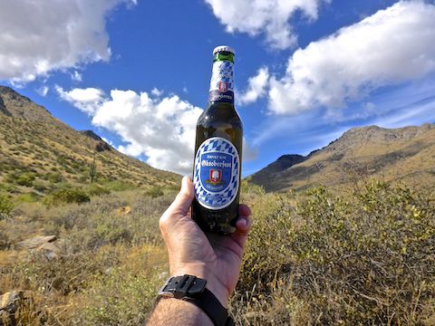 Enjoying a hiking beer, while looking back up at Windgate Pass.
