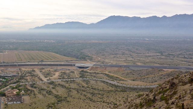 On Main Ridge South, a ½ northeast, and 400 ft. above, the Loop 202 South Mountain Freeway at the west end of Pecos Rd.
