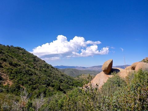 Looking southwest, past a balanced boulder, towards Skull Valley.