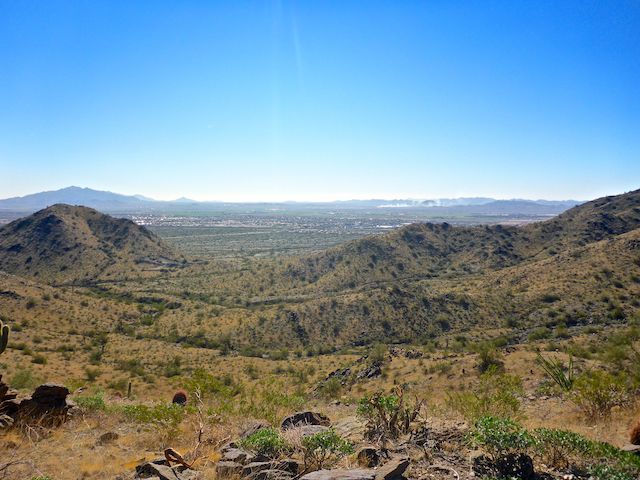 I climbed up a steep, rocky, jeep trail to get to this OP. Looking southwest, across I-10 and Buckeye, to Sierra Estrella, Rainbow Valley, Maricopa Mountains and Buckeye Hills (left to right). Getting up here would be a tricky climb in a Jeep.