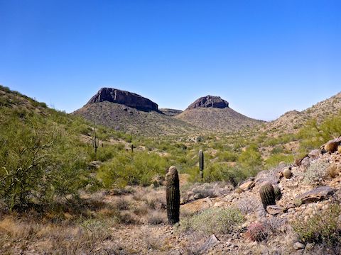 At the first Malpais Trail saddle, looking southwest. The butte on the left is in San Tan Mountain Regional Park; the one on the right, in the Gila River Indian Community.