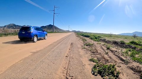Wasn't expecting this SUV to go flying by me. Alta Ridge in the distance; Gila River Indian Community to the right. (GoPro screen cap)