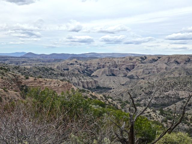 Looking down at the junction of Deer Creek and Arizona Gulch -- which I would be exploring if I had more time and better weather. The rounded formation on the left is Brandenburg Mountain, 11 miles away, at the west end of Aravaipa Canyon.