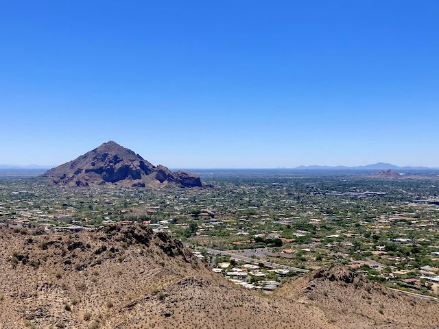 View southeast from the RJ Peak summit. I'm not sure what that is in the distance beyond Papago Buttes ... Maybe the San Tan Mountains?
