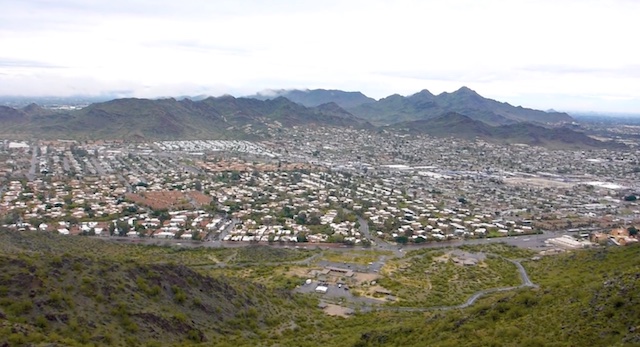 The east side of Sunnyslope, as viewed from North Mountain. The large white building (middle right) is the Fry's at the corner of Cave Creek Rd. and Hatcher Rd. 7th St. in the foreground.