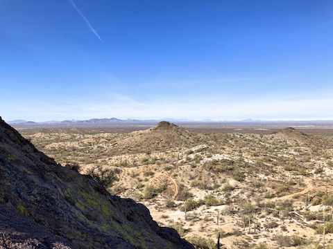 Halfway up Elephant Rock Chute #1. Looking northwest across the Hassayampa Plain. Belmont Mountains, distant left. The near hill has some mines.