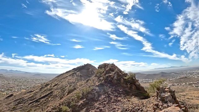 Looking across the second false summit, towards Ludden Mountain's true summit. The Hedgpeth Hills -- home to Thunderbird Conservation Park -- are two miles south. The curve of the horizon is due to my GoPro's wide-angle lens. Great views! 