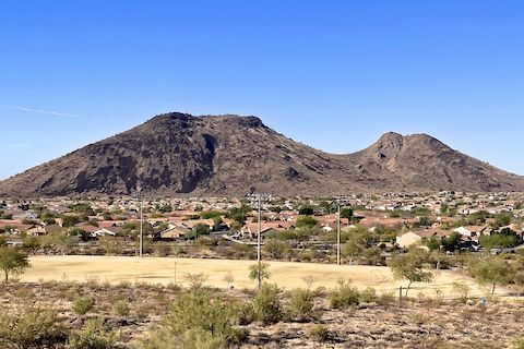 Ludden Mountain, true summit (left) and false summit (right). Notice the slope of both, as well as the saddle. If there were a place to park in the Stetson Valley neighborhood, heading up the face of the saddle, from right to left looks doable. So does a direct climb up the the southeast spur (far left) of the true summit.