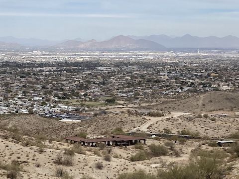 From Crosscut Trail, looking northeast across Vista Point / Big Ramada, and the Phoenix Police Academy, to Camelback Mountain. If you hear shooting, no worries: It's the police range.