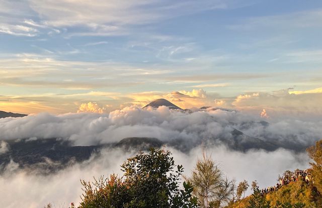 Mount Bromo, at an azimuth of ~160° from Bukit Cinta, 15 minutes after the sun rose over Mount Iyang-Argapura, at 95°. Tourists oohing & aahing lower right.