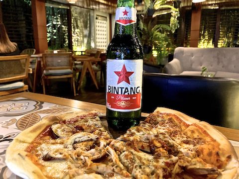 Beer & pizza in Planet Kopi, Aston Jember’s poolside bar. Interesting that they have alcohol in Indonesia, but the “bacon” is actually beef. (Tasty, but not pork.)