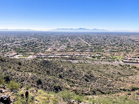 Peoria Sunrise Mountain Preserve: Looking south, down at the Miner's Shaft Pass switchbacks, from Sunrise Ridgeline. Sierra Estrella in the distance.