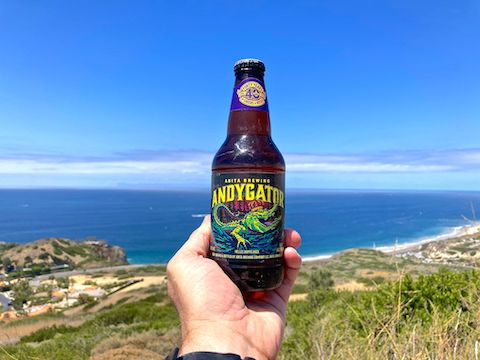 Enjoying a hiking beer above Abalone Point (left) and Crystal Cove (right).