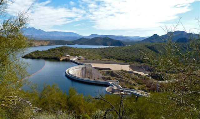 Stewart Mountain Dam holds back the Salt River, creating Saguaro Lake. Four Peaks in the distant (left).