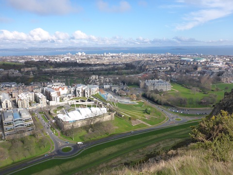 Looking down at the Scottish Parliament, Holyrood House, and across Leith to Easter Road.