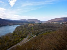 Looking west, across the Potomac River, from the top of Weverton Cliffs. Harpers Ferry is near the bottom of Blue Ridge in the distant middle. The Maryland Heights on the right.