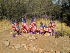 19 flags and a fire truck for he fallen Granite Mountain Hotshots.