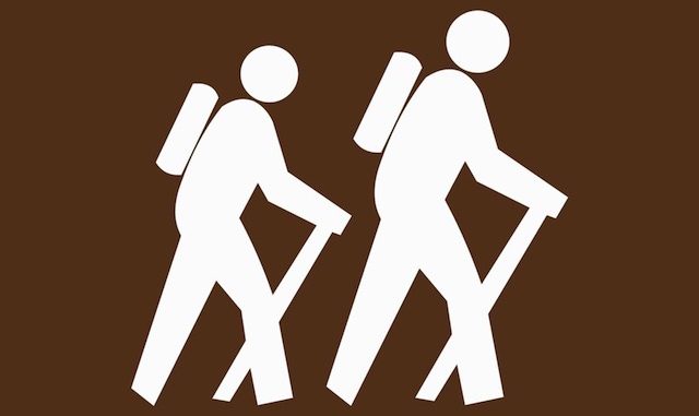generic white hiker on brown background sign