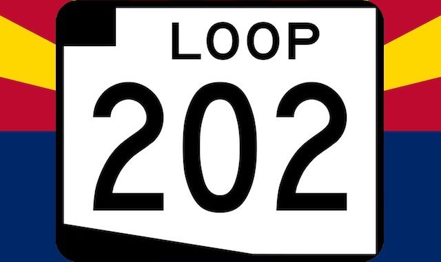 Loop 202 South Mountain Freeway sign on Arizona flag backgroound.