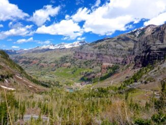 Looking northwest, down Black Bear Pass Rd., past Idarado's Pandora Mill, to the east end of Telluride. I believe the snow-capped mountains are Campbell Peak and Gibson Peak.