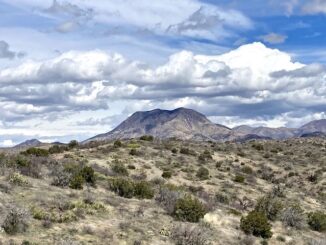 Clouds rolling in over Stanley Butte, seven miles northeast, just inside the San Carlos Apache Reservation.