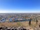 Arrowhead Lakes, as viewed from the summit of Arrowhead Point. Sierra Estrella peaking through the I-10 smog, 25 miles away. Coachwhip Trail traverses the area below the lakes.