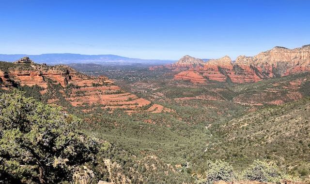 Schnebly Hill Vista, looking west down Casner Canyon, towards Sedona, Steamboat Rock, Wilson Mountain, and Capitol Butte. Mingus Mountain and Woodchute Mountain are far left.