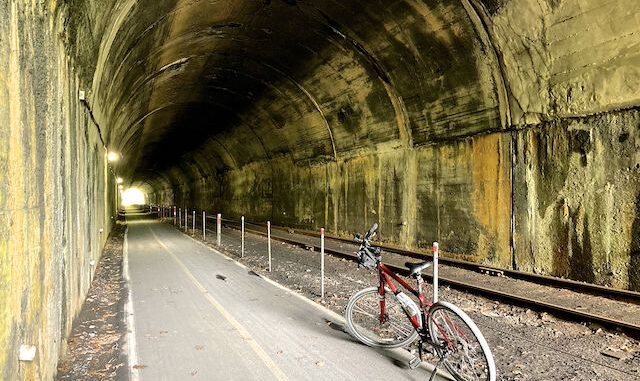 Brush Tunnel: Signs warn to stay trailside of the fence, walk your bike though, and not to enter Brush Tunnel with an oncoming train. Did, did not, and would have. (No way I'm missing that shot!)