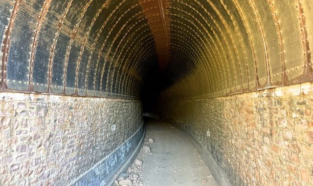 Johnson Canyon Railroad Tunnel. It's steel plate ceiling replaced the original wood trusses, which burned in 1898.
