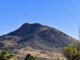 Ludden Mountain, viewed from 67th Ave. My intended route, was from the knob on the left, up & right along the lighter band, to the top of the lower black mass, then a left turn to the summit.