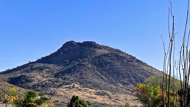 Ludden Mountain, viewed from 67th Ave. My intended route, was from the knob on the left, up & right along the lighter band, to the top of the lower black mass, then a left turn to the summit.